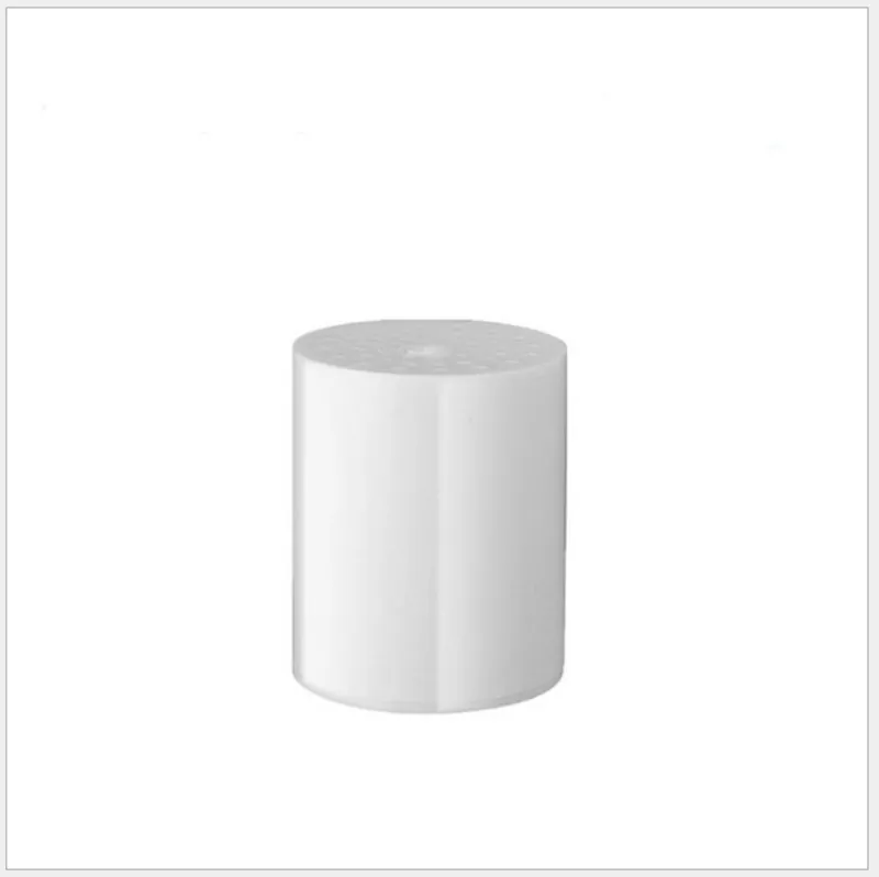 A spare 15-layer filter cartridge, a plain white cylinder